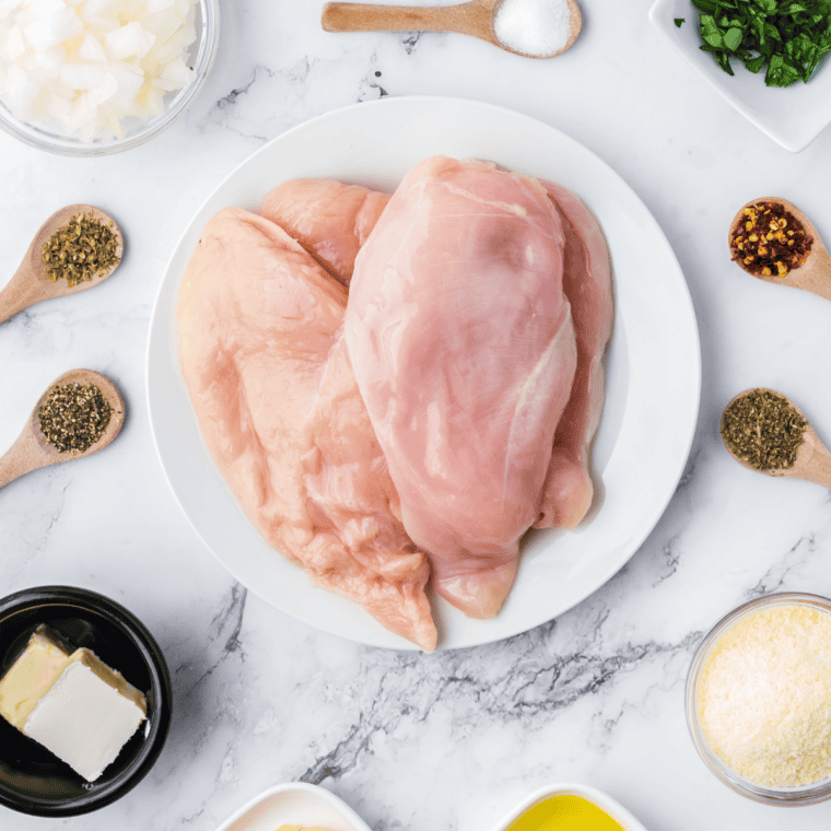 Ingredients photo: Ingredients for Instant Pot chicken enchiladas — chicken breast, red enchilada sauce, tortillas, and shredded cheese