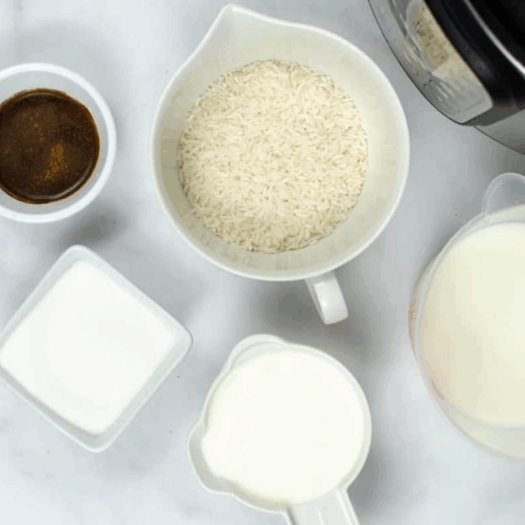 Ingredients needed for Creamy Rice Pudding With Condensed Milk on kitchen table.