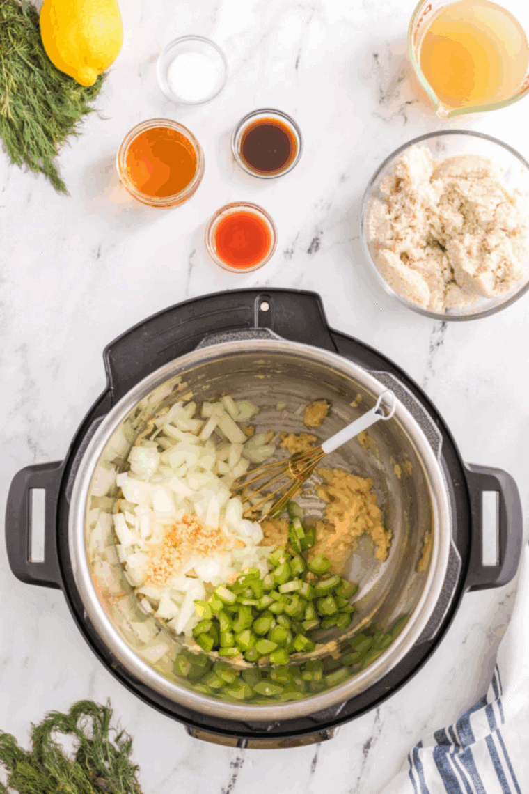 Sautéing onions, celery, and garlic in the Instant Pot until softened