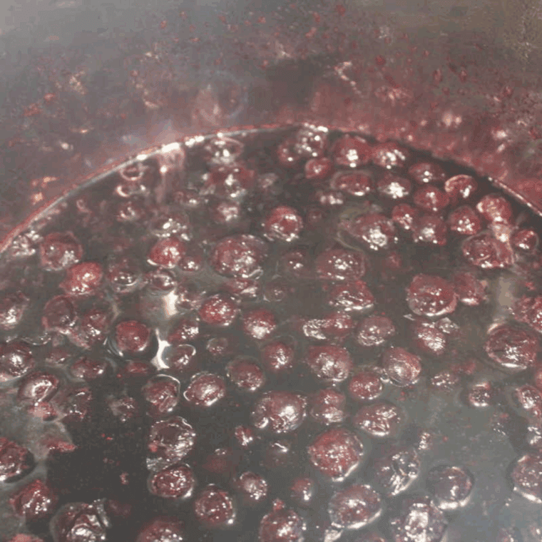 Homemade blueberry pancake syrup cooking in an Instant Pot, rich and glossy.