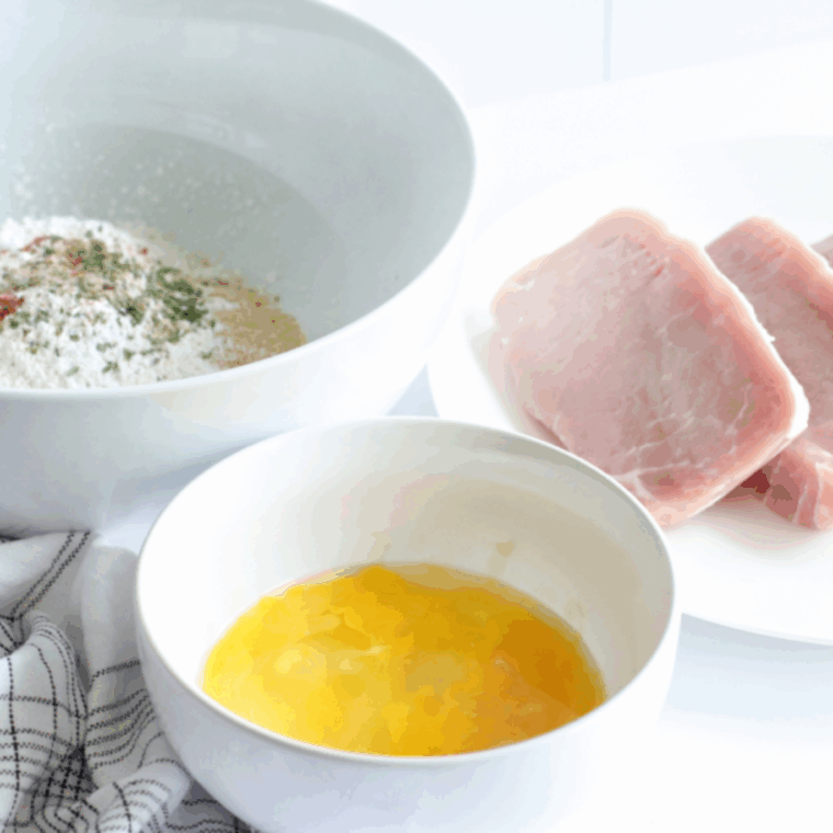 Ingredients needed for Shake ‘N Bake Style Pork Chops in the Ninja Foodi on kitchen table.