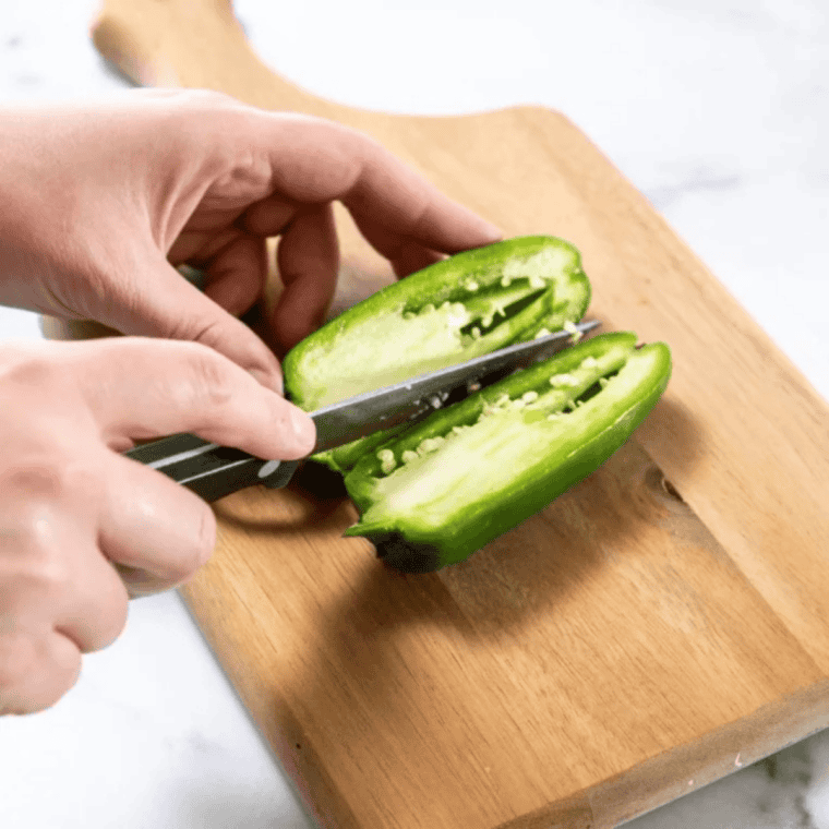 Fresh jalapeno peppers halved lengthwise with seeds and white membranes scraped out