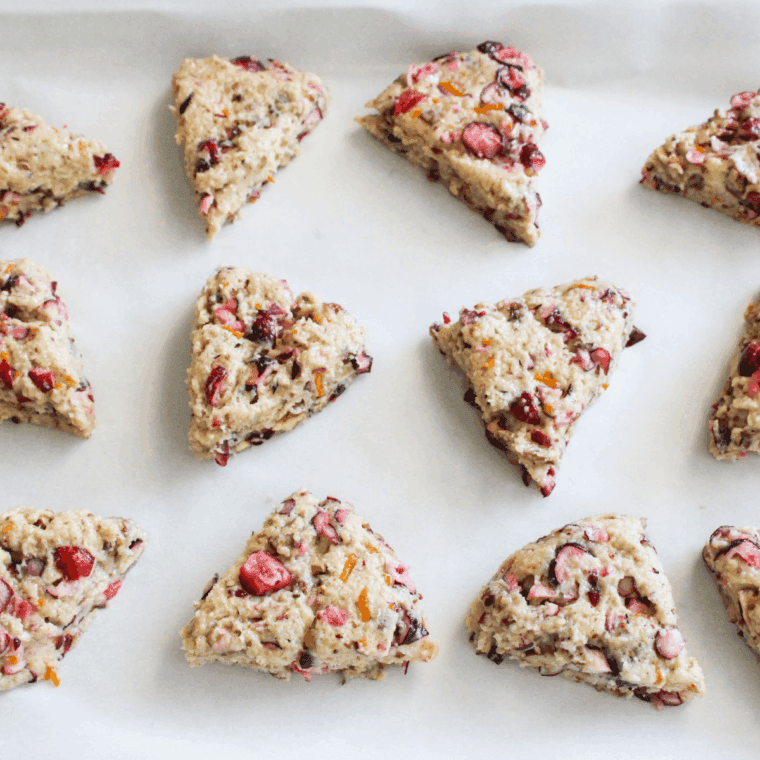 Air fryer cranberry scones baked golden with visible cranberry pieces.