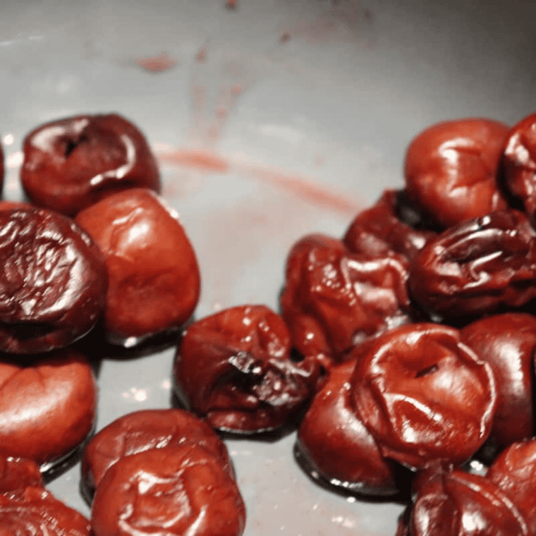 Start with half the cherries: Half the cherries with sugar and lemon juice added to an Instant Pot