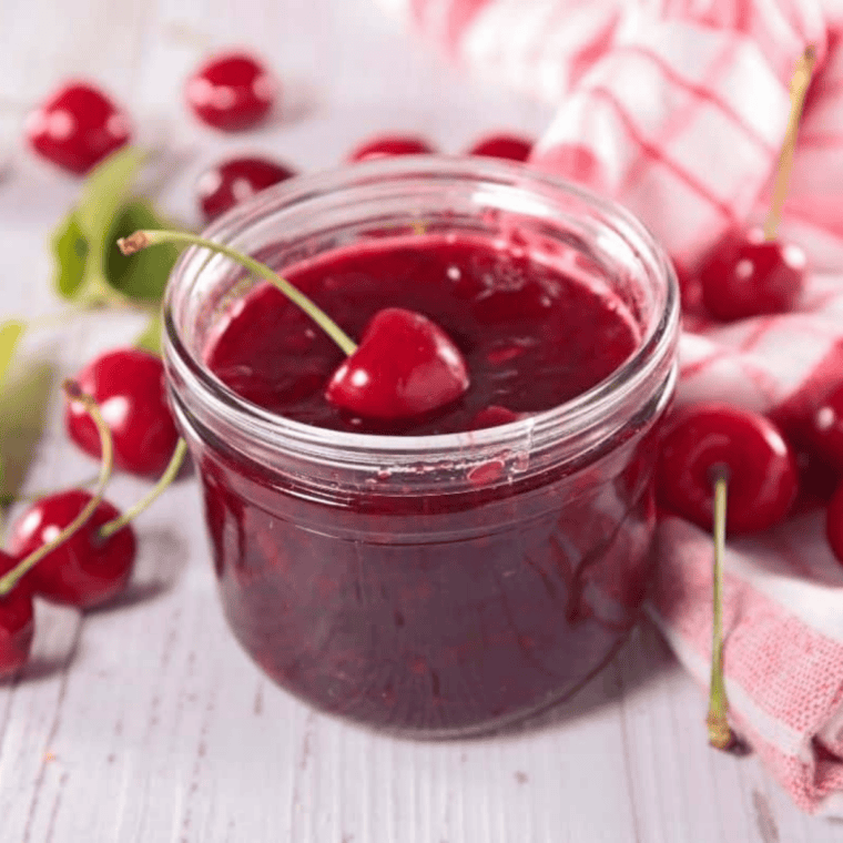 Serve or store: Finished Instant Pot cherry jam served warm over pancakes