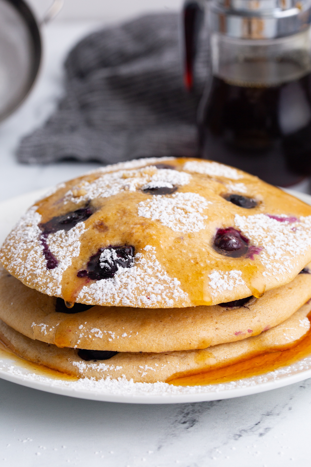 Air fryer pancakes served warm with syrup and toppings