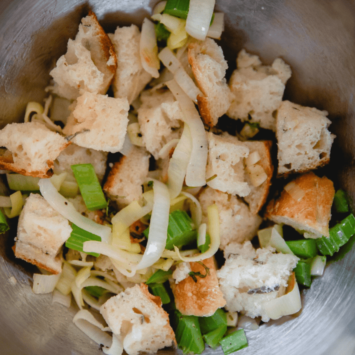 Cubed cornbread in a mixing bowl ready for the dressing