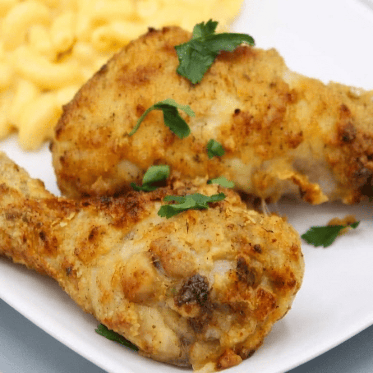 Crispy air fryer Kentucky Kernel fried chicken drumsticks in the air fryer basket