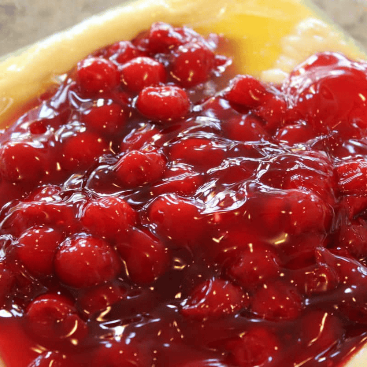 Cherry pie filling spooned over the batter before air frying