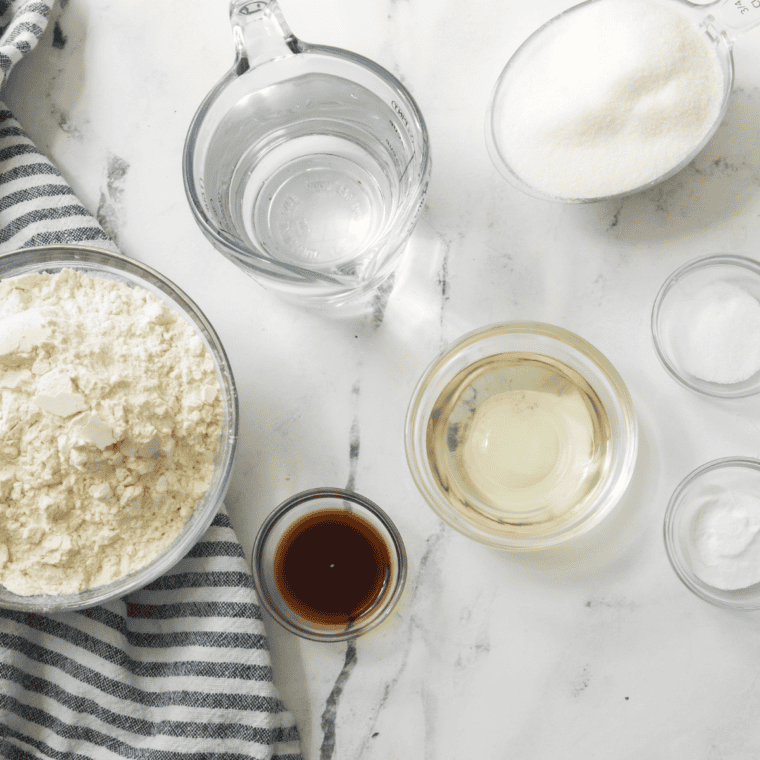 Ingredients for air fryer lemon ricotta cake: ricotta, eggs, flour, sugar, butter, and fresh lemons