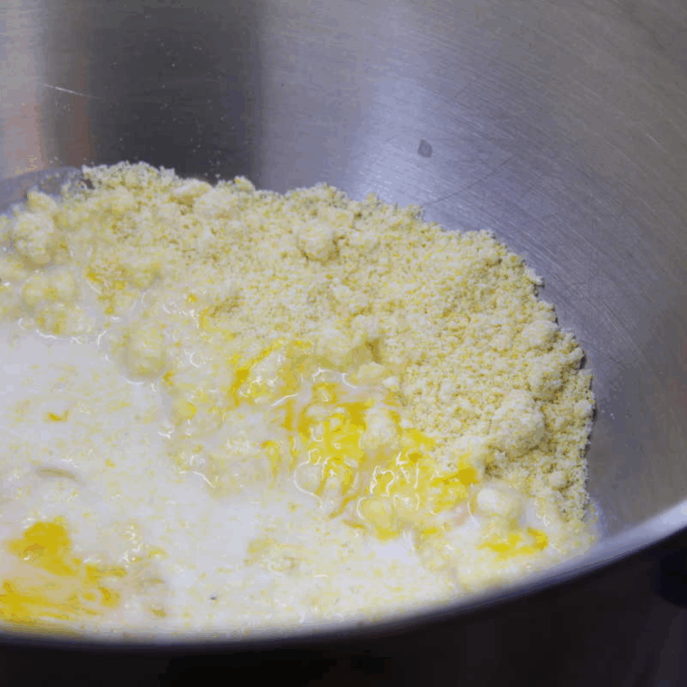 Mixing Jiffy corn muffin mix, milk, egg, and melted butter in a bowl