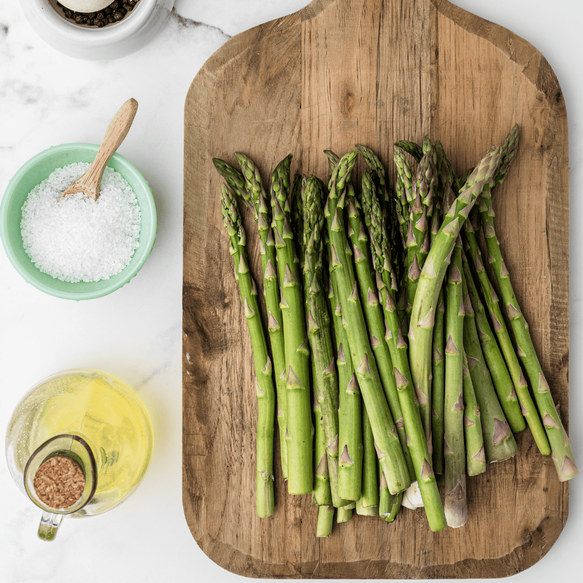 Ingredients needed for Easy Air Fryer Prosciutto Wrapped Asparagus on kitchen table.
