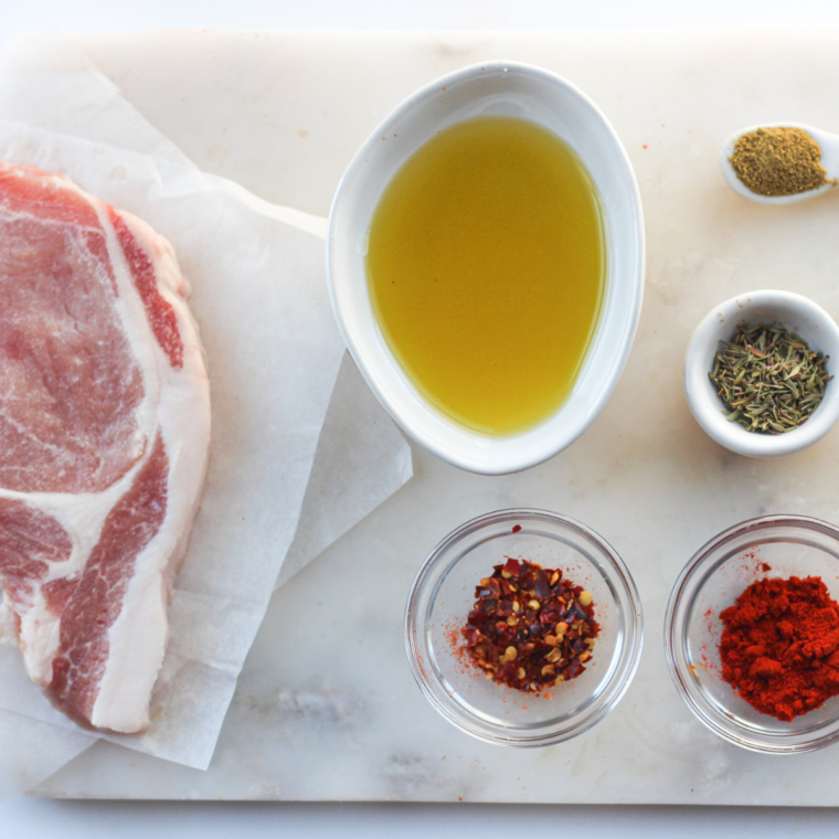 Ingredients needed for Air Fryer Pork Steaks on kitchen table.