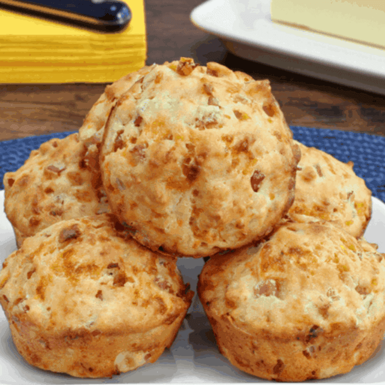 Golden air fryer savory muffins with bacon, basil, and melted cheddar