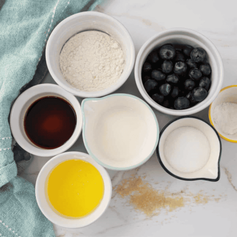 Ingredients needed for Easy Air Fryer Blueberry Pie on kitchen table.