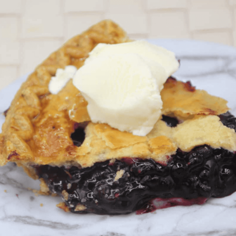 Golden air fryer blueberry pie with flaky crust and sweet blueberry filling