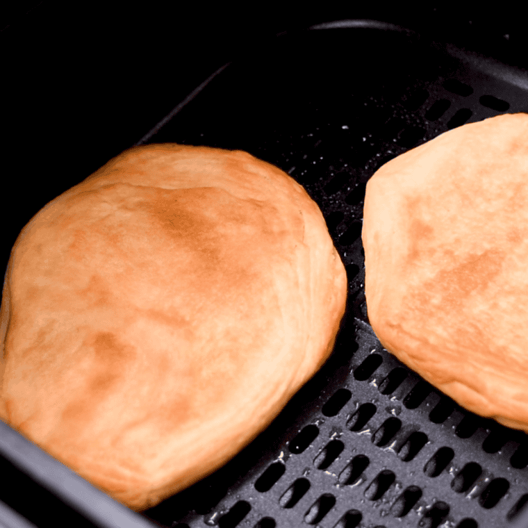 Arrange biscuit dough in a single layer for crispy and evenly cooked air fryer fry bread.