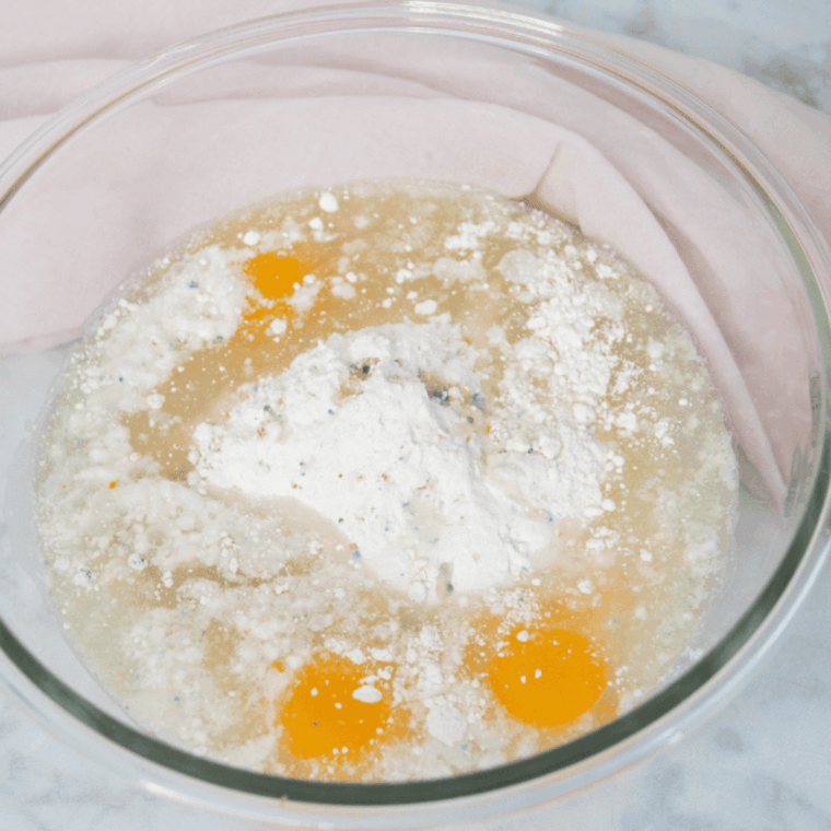 Placing pineapple slices and cherries in pan before pouring cake batter