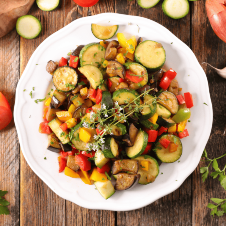 Crispy air fryer yellow squash and zucchini slices golden brown on plate