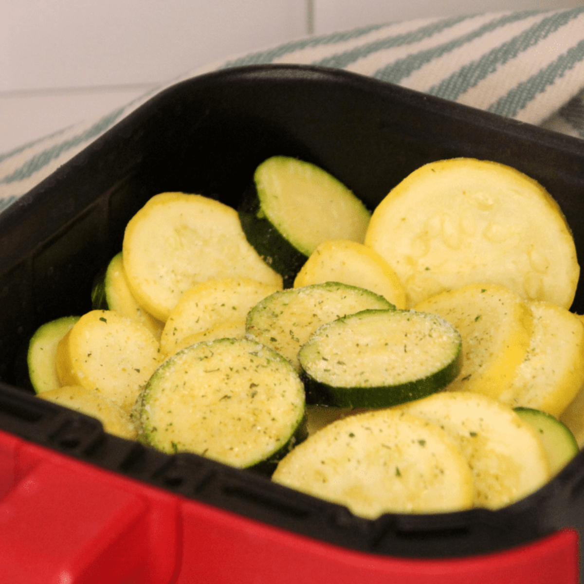 Air fryer preheating to 400°F before adding squash and zucchini