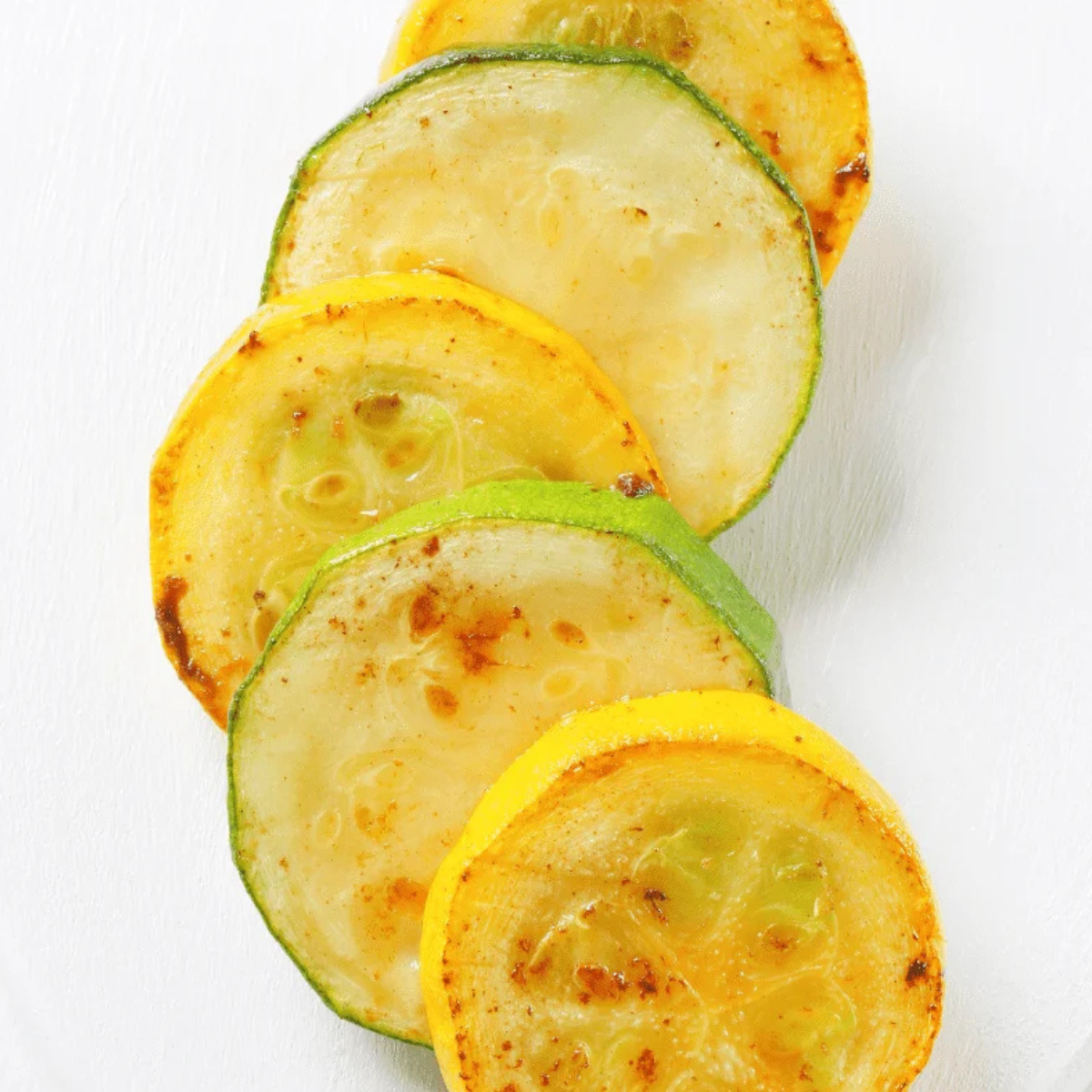 Crispy air fryer squash and zucchini finished with parmesan lemon and herbs