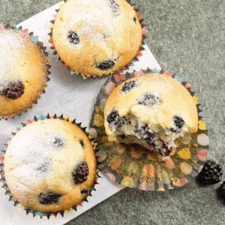 Golden air fryer blackberry lemon poppy seed muffins with juicy blackberries and a zesty lemon crumb topping