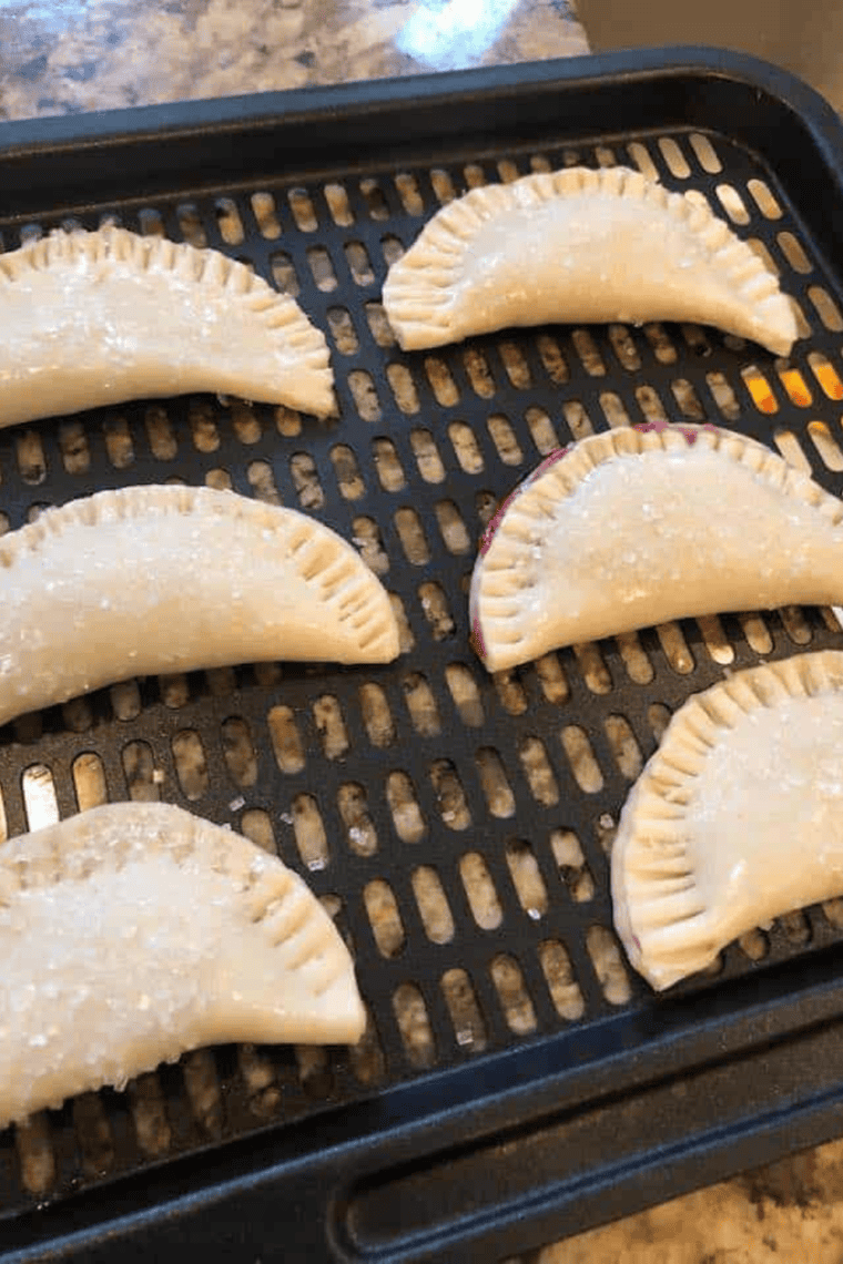 Place Blueberry Hand Pies on the air fryer tray or in the air fryer basket.