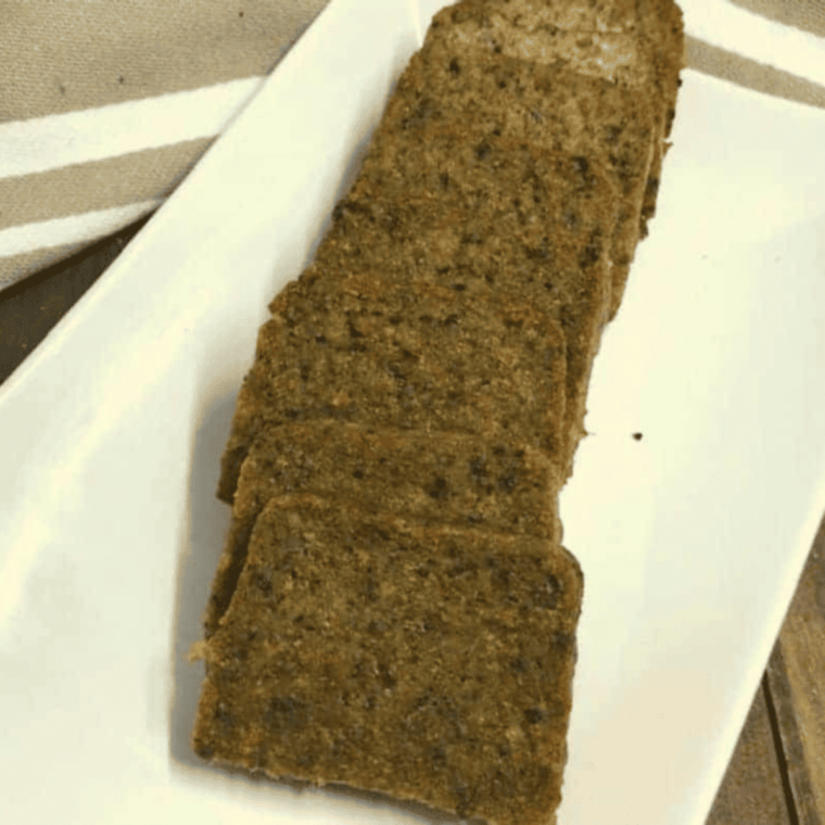 Crispy air fryer scrapple slices plated with a fried egg and toast