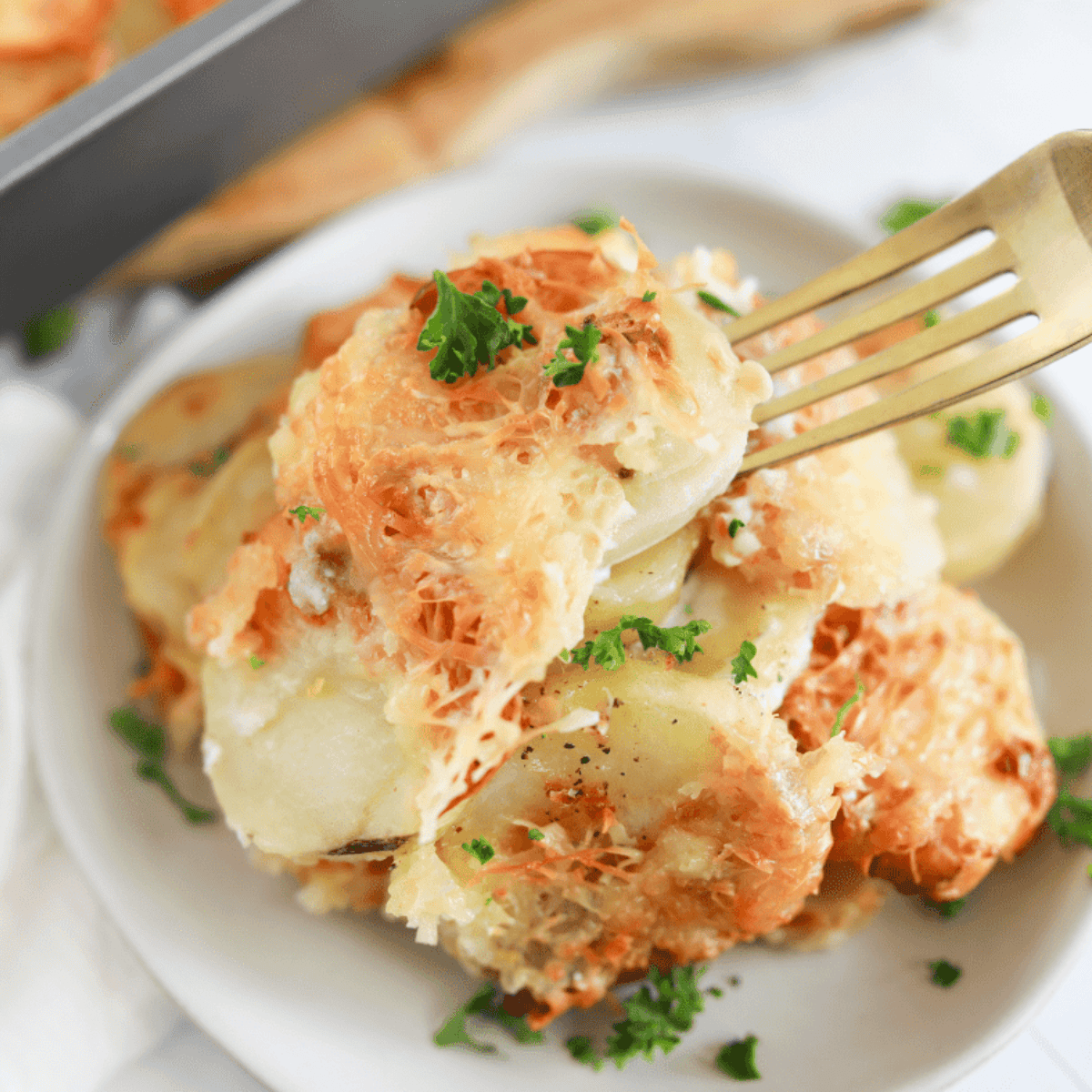 Crispy, golden Air Fryer Au Gratin Potatoes served on a plate