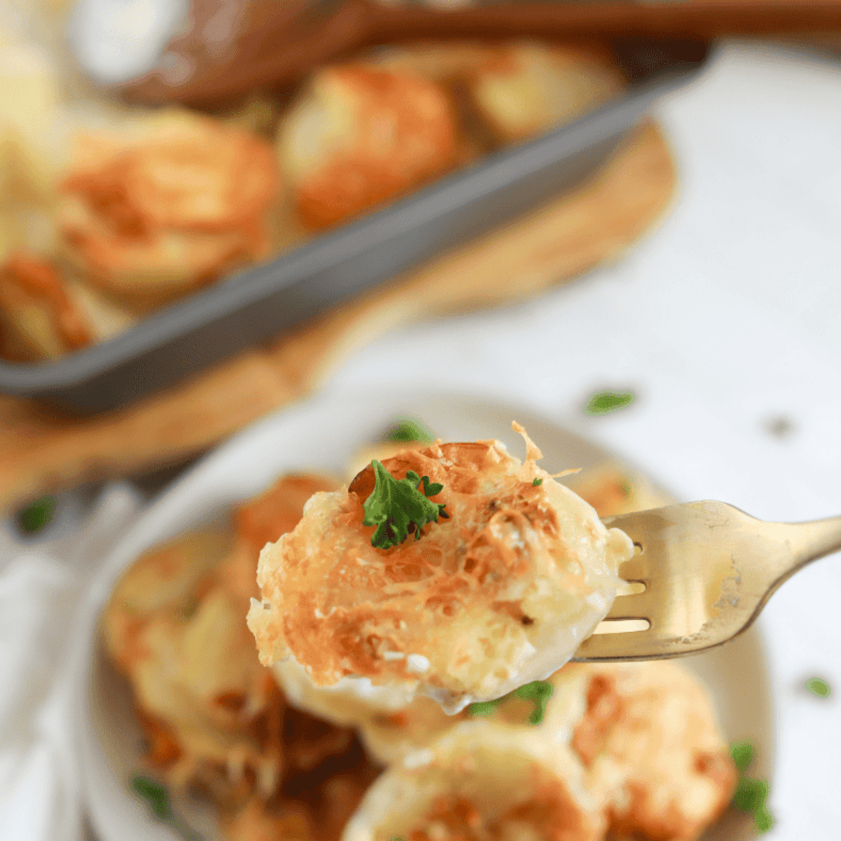Finished Air Fryer Au Gratin Potatoes with golden, bubbly topping