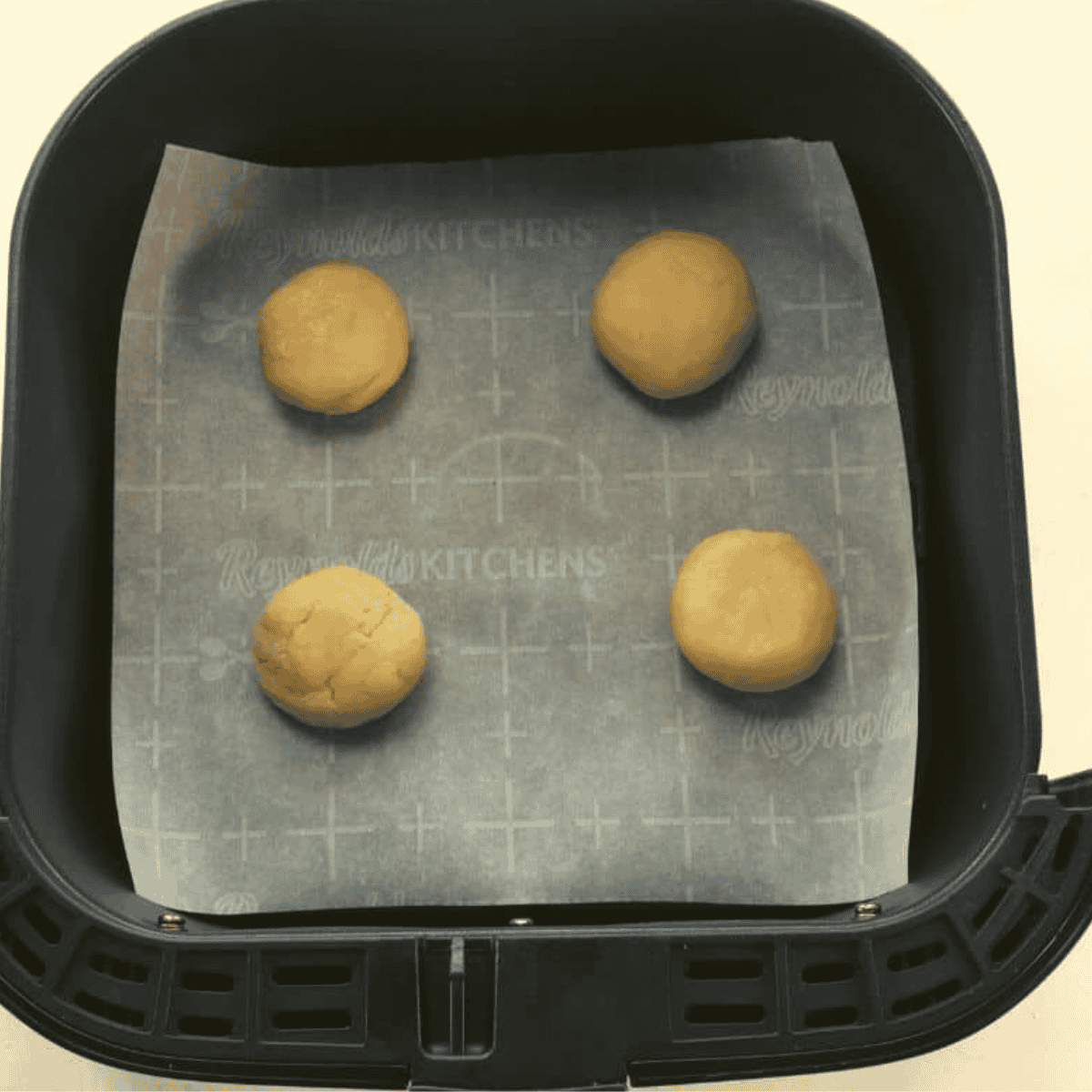 Air fryer tray placed in the middle rack, cooking cookies at 350°F..