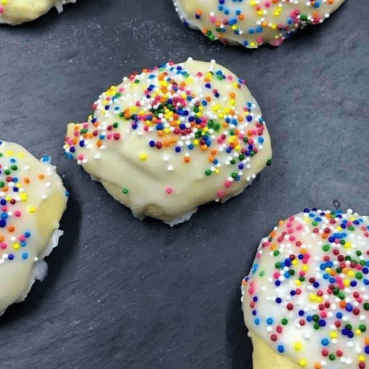 Freshly baked soft and chewy air fryer Italian cookies on a cooling rack.