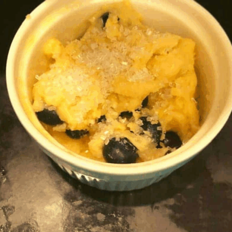 Spraying muffin tin or ramekin and pouring in prepared batter