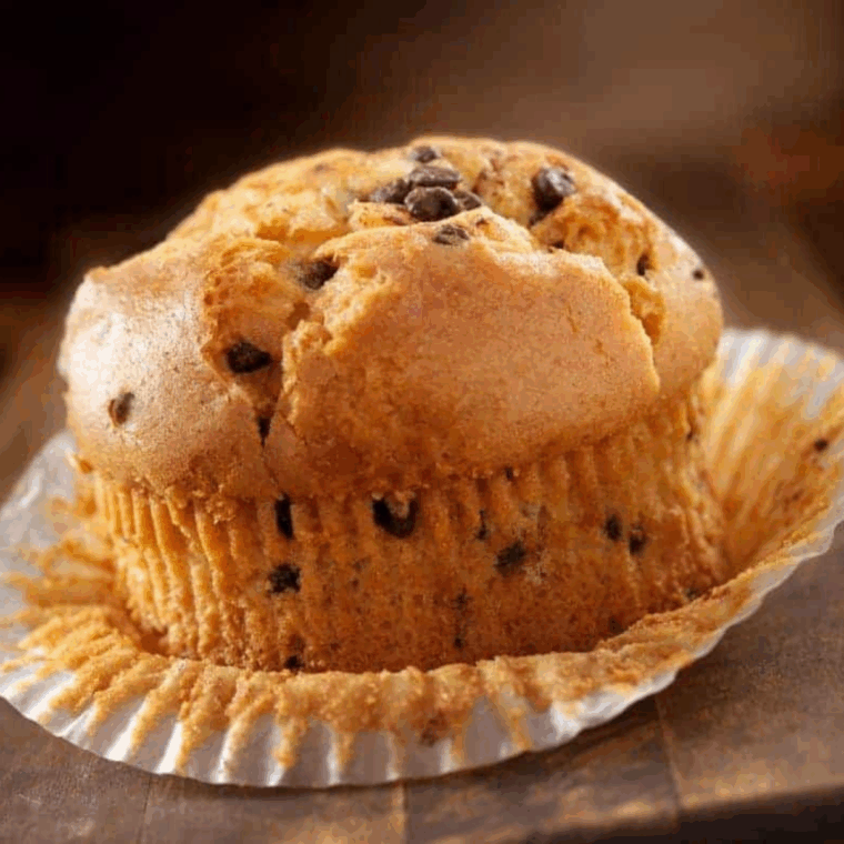 Single-serving chocolate chip muffin baked in air fryer, golden and fluffy