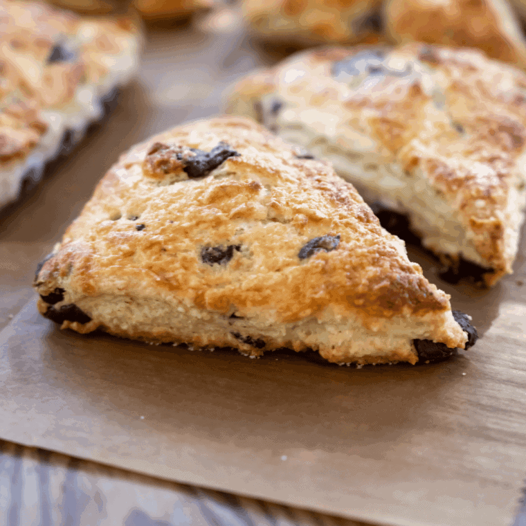 Air fryer chocolate chip scones golden brown, soft inside, ready to serve.