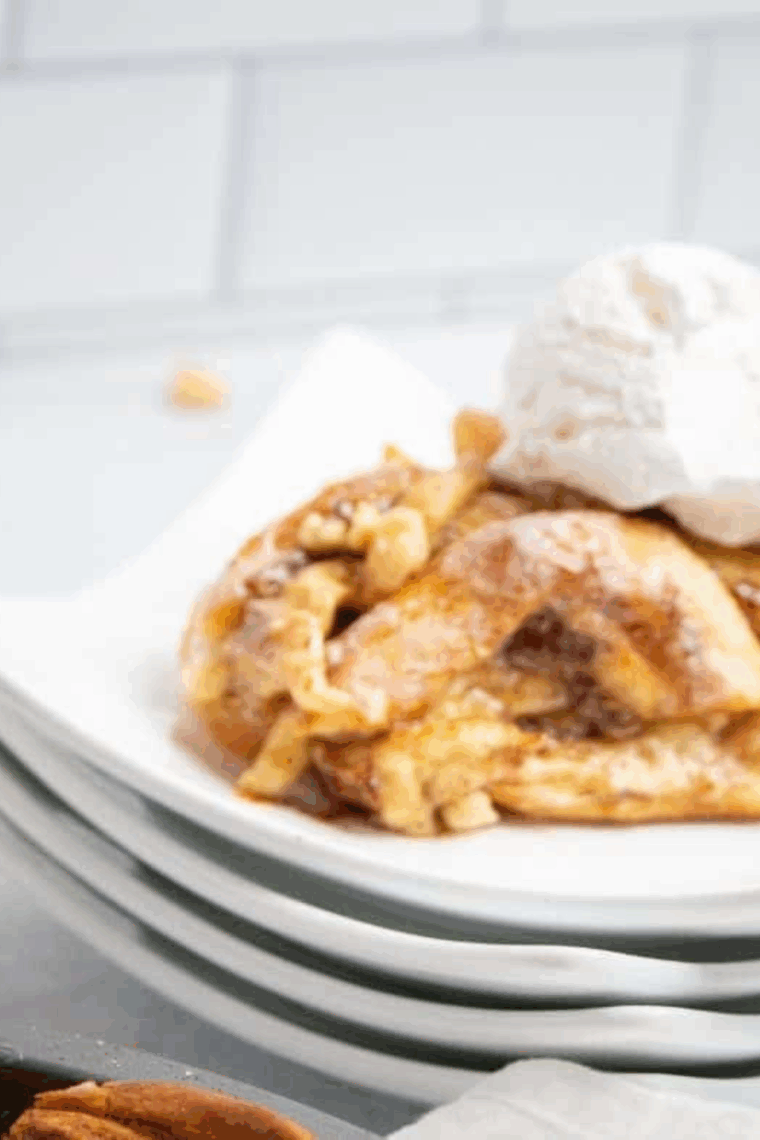 Slice of cinnamon roll apple pie with warm apple filling