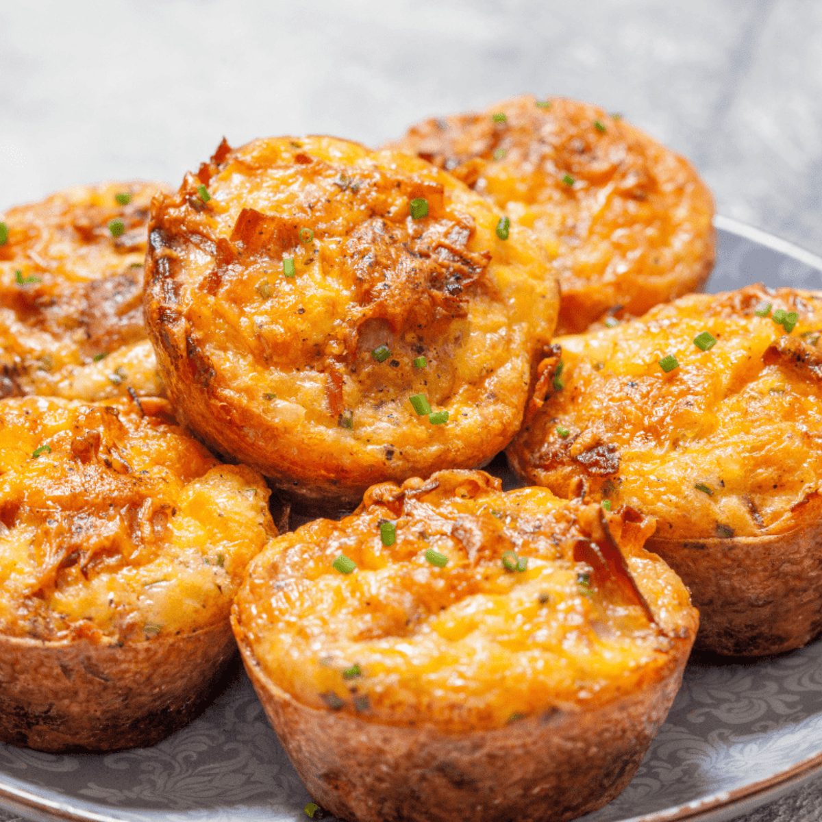 Air fryer ham and cheese muffins cooked until golden and fluffy