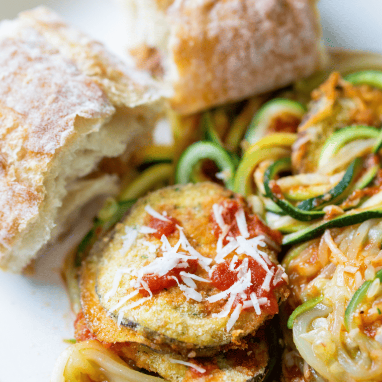 Air fryer zucchini noodles cooked until tender and lightly crisp, served in a bowl as a low-carb pasta alternative.