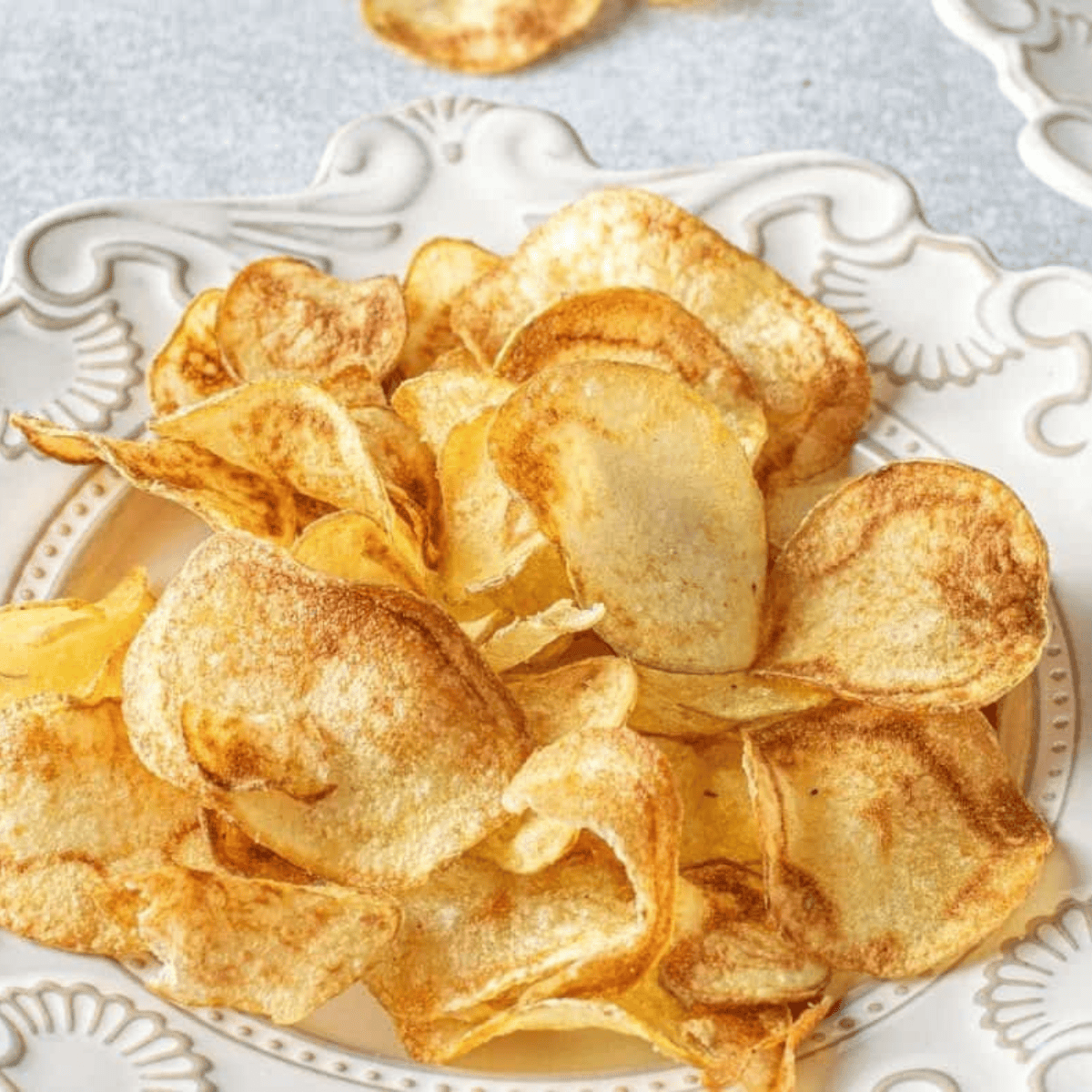 Crispy air fryer homemade Lay’s-style potato chips served in a bowl.