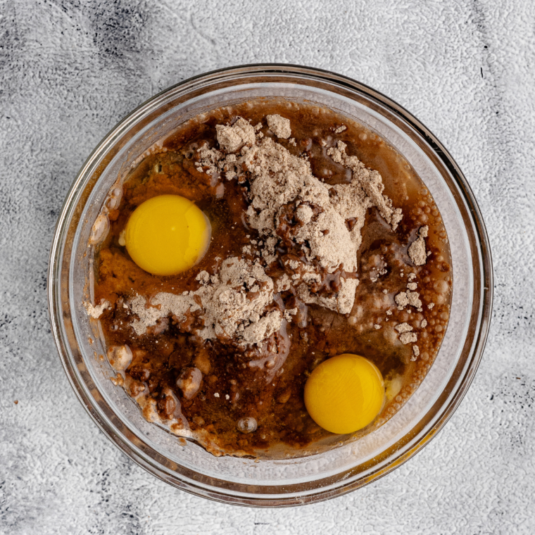 Melted chocolate butter poured into whisked eggs