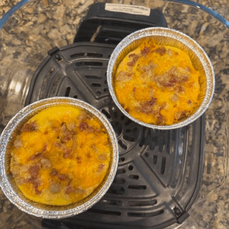 Ninja Crispi breakfast casserole with eggs, cheese, and breakfast meats, baked until golden