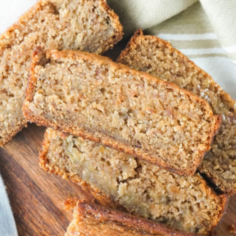 Golden air fryer gluten-free banana bread cooling on a wire rack