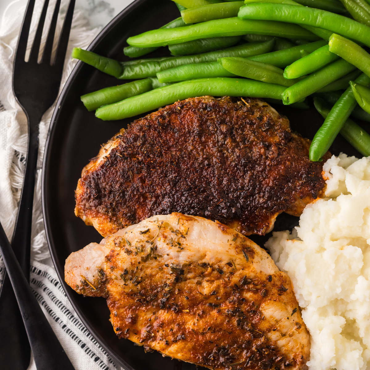 Honey garlic pork chops coated in sticky glaze, fresh from the air fryer