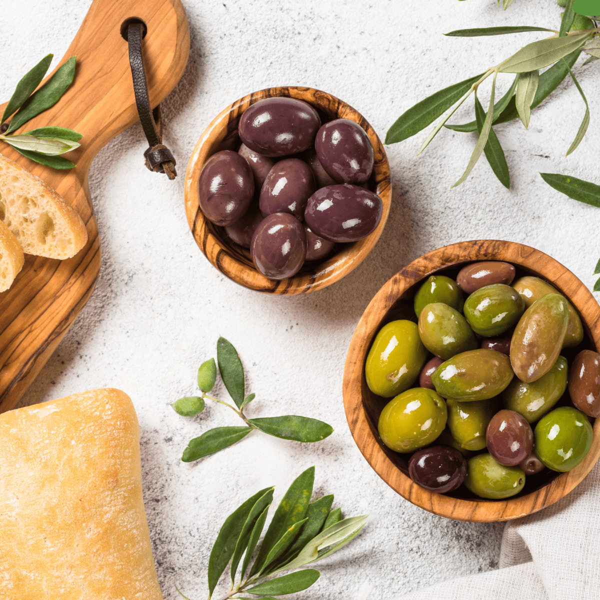 Ingredients needed for Air Fryer Marinated Olives on kitchen table.