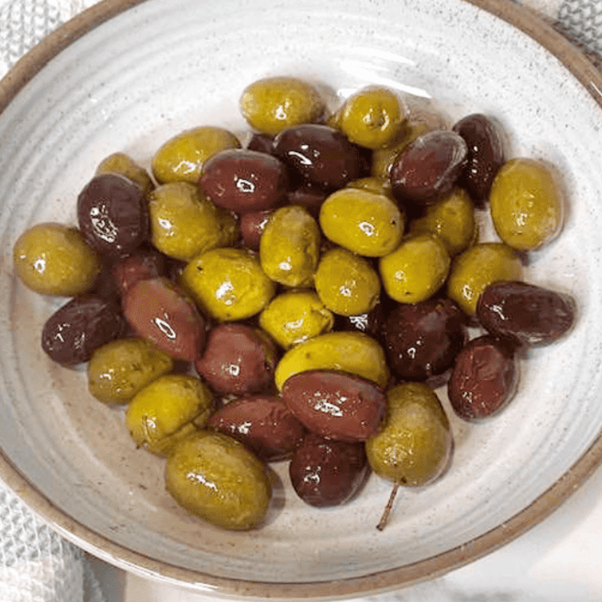 Golden, crispy air fryer marinated olives served in a bowl, ready to enjoy as a snack or appetizer.