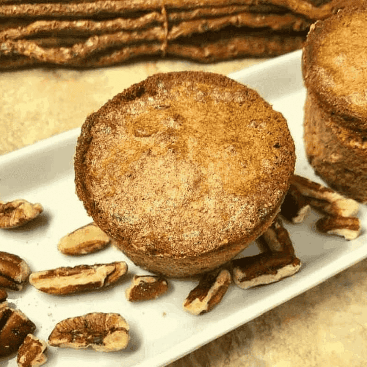 Air fryer pecan pie muffins with golden tops and chopped pecans