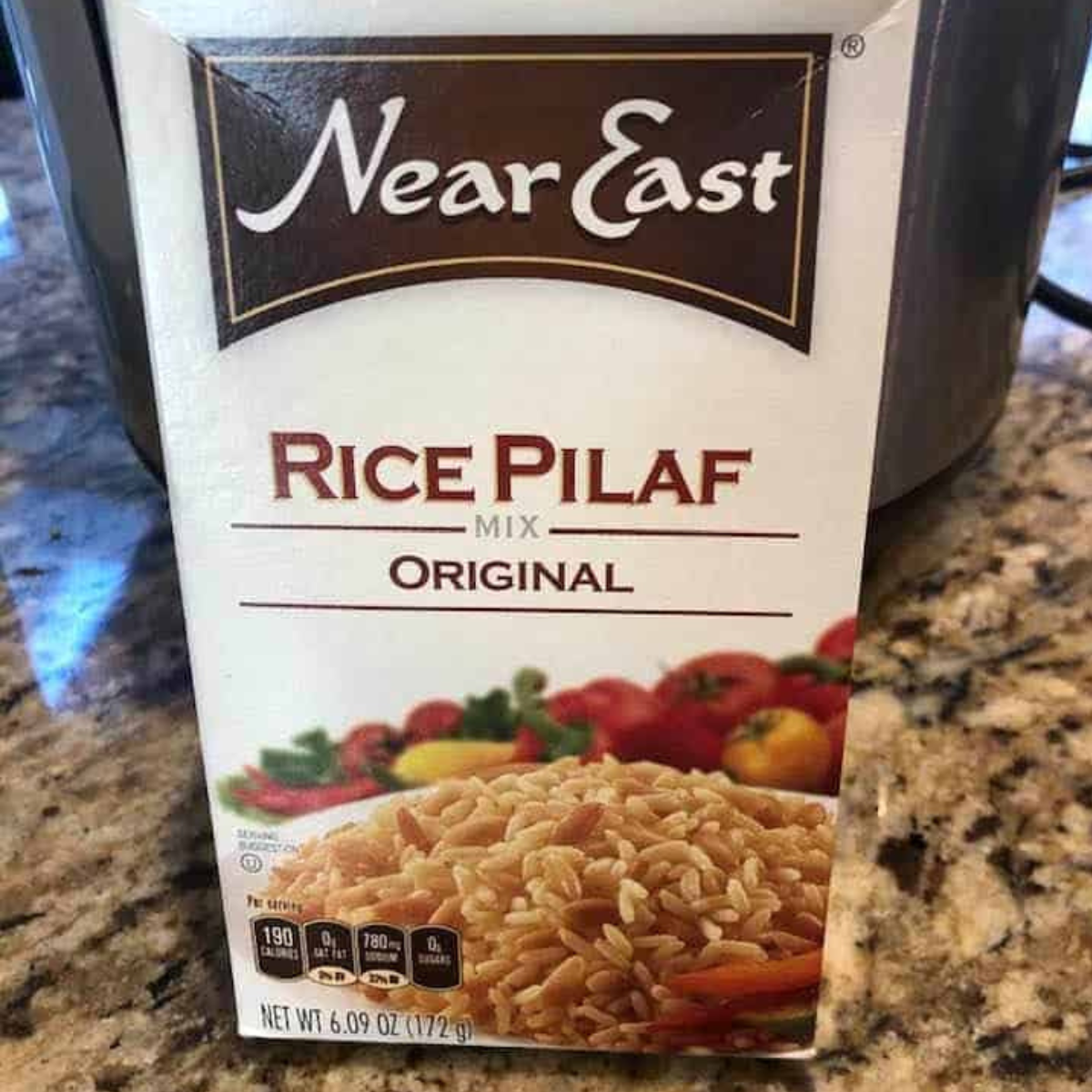 Near East Rice Pilaf Instant Pot ingredients on kitchen table.