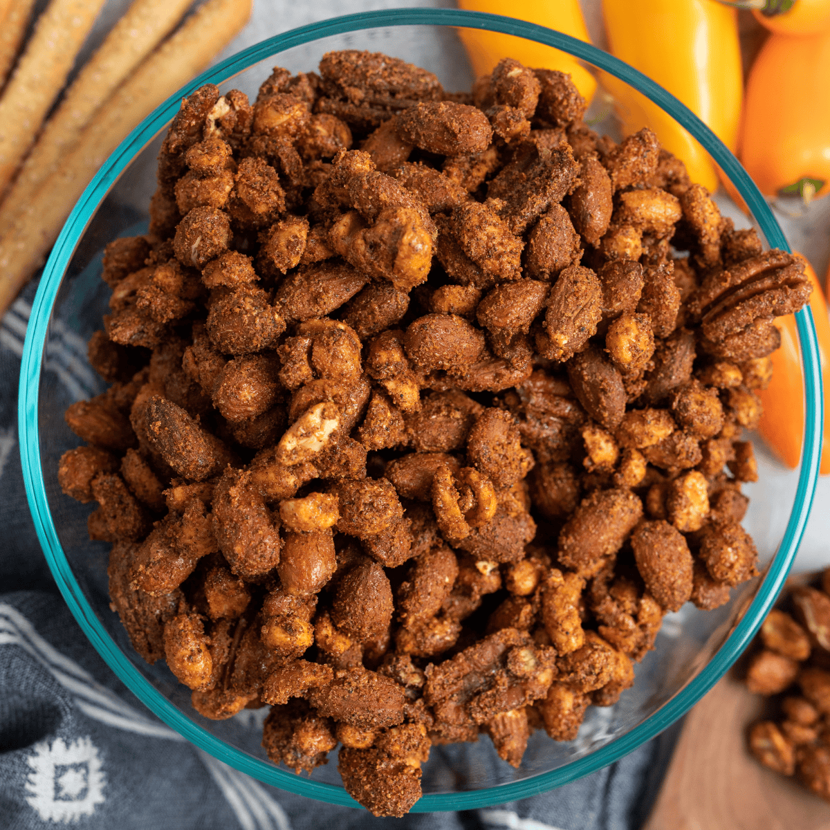Bowl of air fryer roasted mixed nuts with almonds, pecans, cashews, and walnuts tossed in herbs