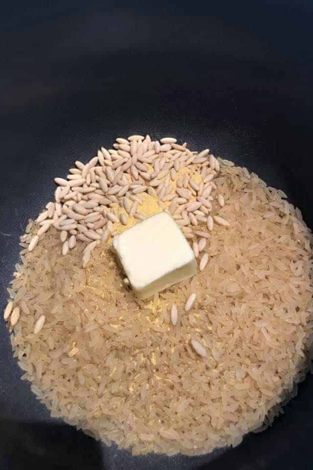 Adding packaged rice pilaf, water, and butter to Instant Pot