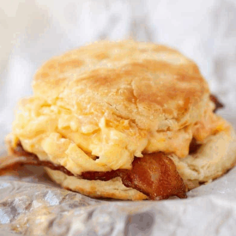 Easy Air Fryer Breakfast Biscuits with eggs and crispy bacon. Perfect for a quick, hearty morning meal.
